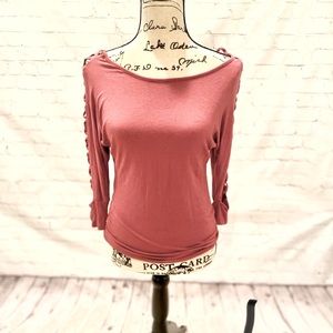 Fitted, soft, long sleeve. Open design down arm.